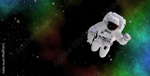 Astronaut in deep space. Discovering the mysterious parts of the universe. Elements of this image furnished by NASA.