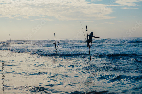 Local fisherman on stick on a beach of Indian ocean, Sri Lanka