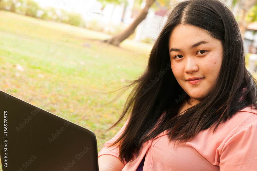 young business woman working at the computer on the nature young business woman working at the computer on the nature