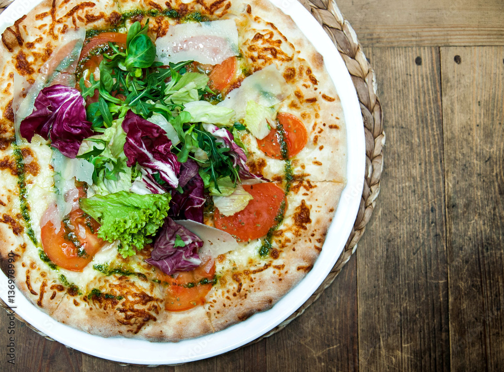 tasty pizza on wooden table with fresh green tasty pizza on wooden table with fresh green