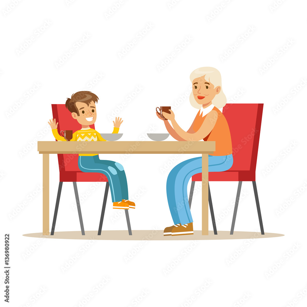 Grandmother Having Breakfast With Boy, Part Of Grandparents Having Fun With Grandchildren Series