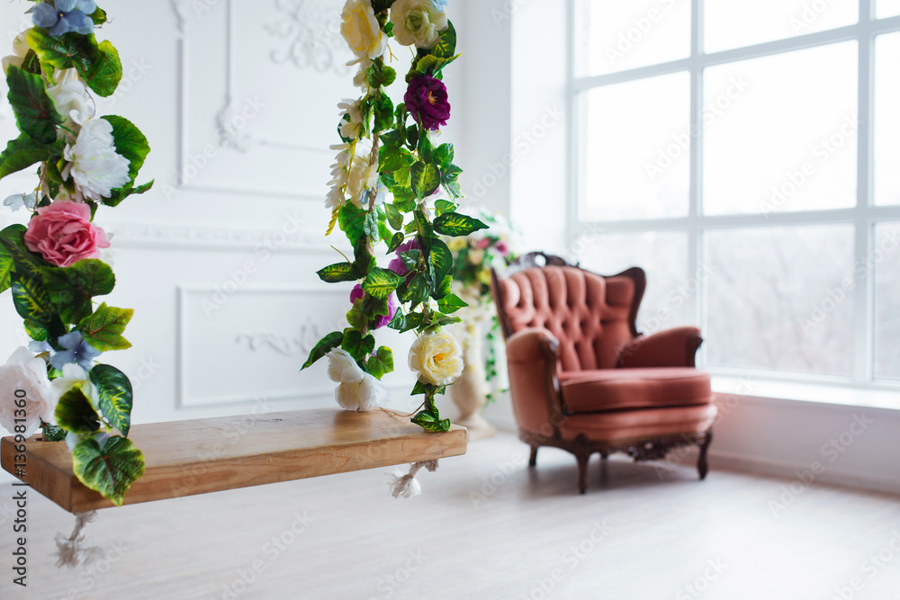 Vintage style chair in classical interior room with big window and flowers