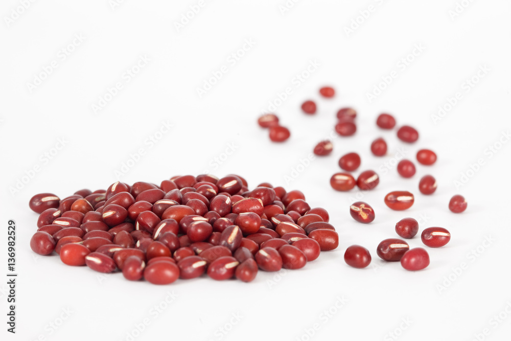 Pile of red azuki beans on white background. Vegan vegetarian healthy food. Pile of red azuki beans on white background. Vegan vegetarian healthy food.