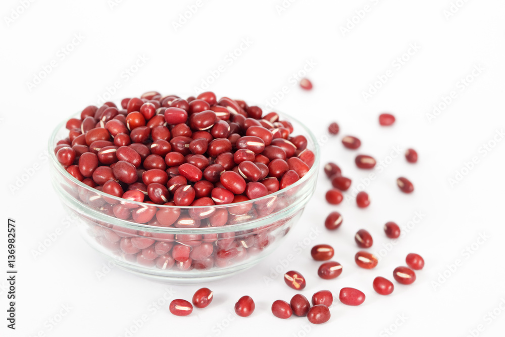 Red azuki beans in glass bowl on white background. Vegan vegetarian healthy food. Red azuki beans in glass bowl on white background. Vegan vegetarian healthy food.