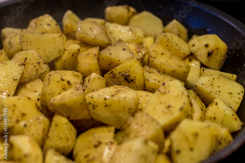 Cooking fried potatoes with spicies