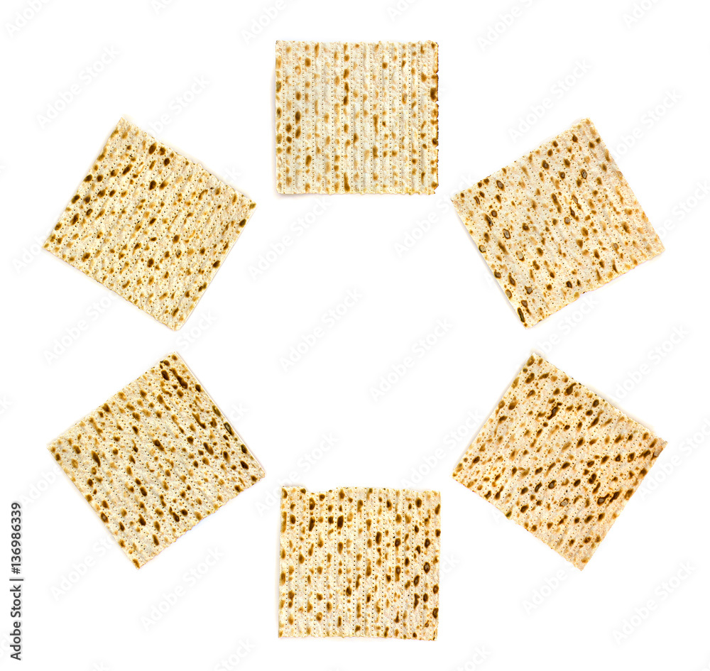 Frame of matzo on white background. Top view, flat lay Frame of matzo on white background. Top view, flat lay