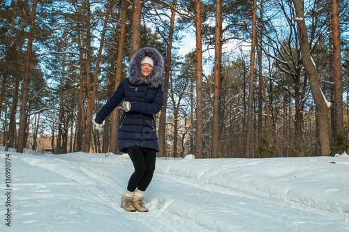 young woman snow winter pine forest photo