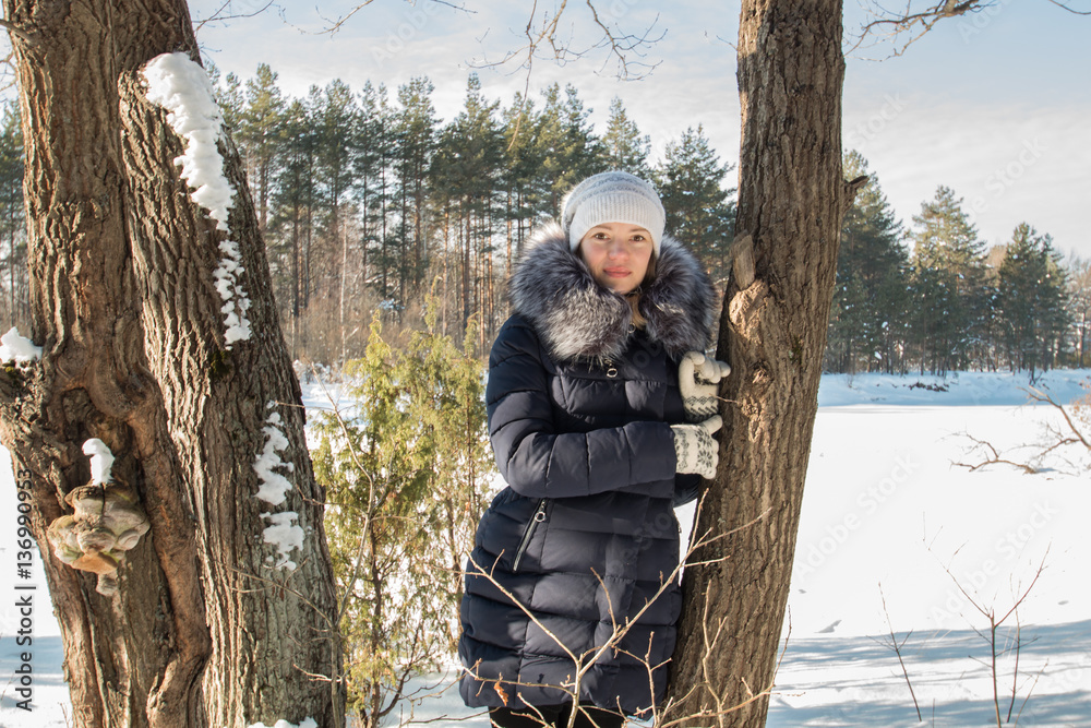 Naklejka premium young woman snow winter pine forest