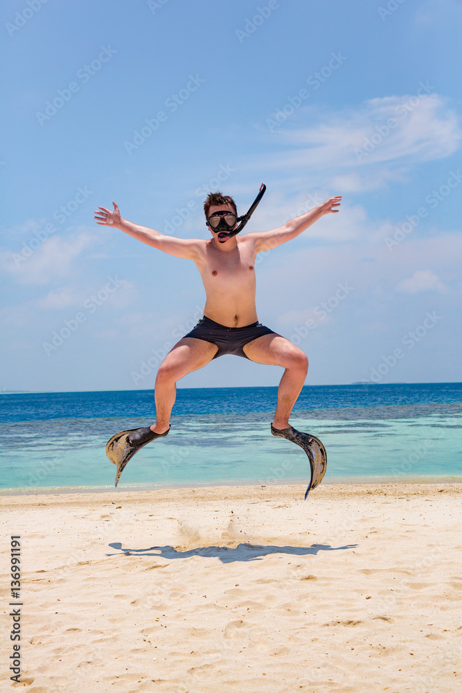 Funny man jumping in flippers and mask. Funny man jumping in flippers and mask.