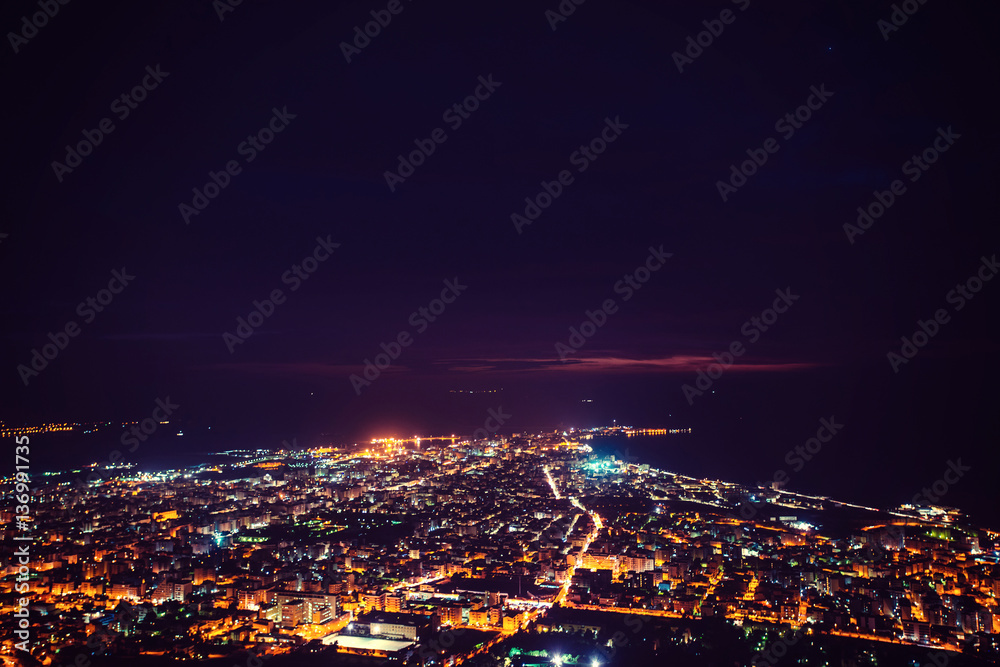 Fototapeta premium Fantastic aerial view of city illuminated with lights. Location 