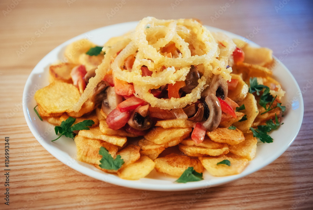 salad with fried potatoes, mushrooms and tomatoes salad with fried potatoes, mushrooms and tomatoes