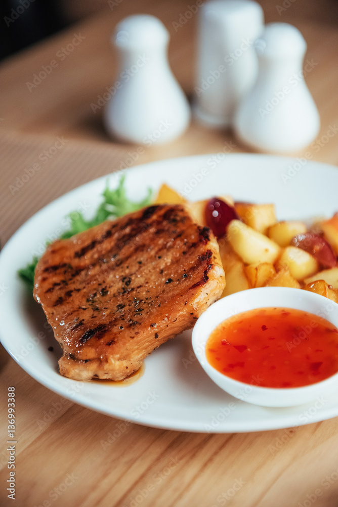 Steak with crispy golden fries and tomato spicy sauce Steak with crispy golden fries and tomato spicy sauce
