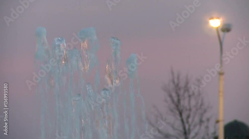 Fountain in a city during the evening hours