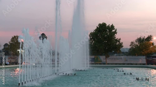 Fountain in a city during the evening hours