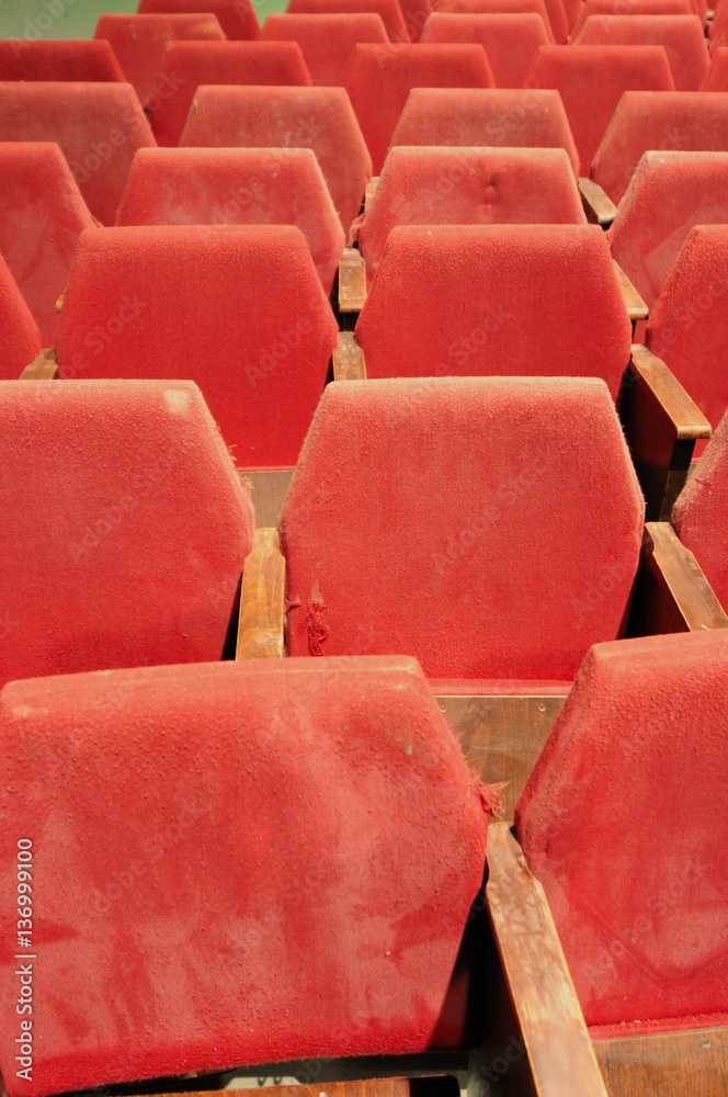 Old abandoned dusty red theater seating Old abandoned dusty red theater seating