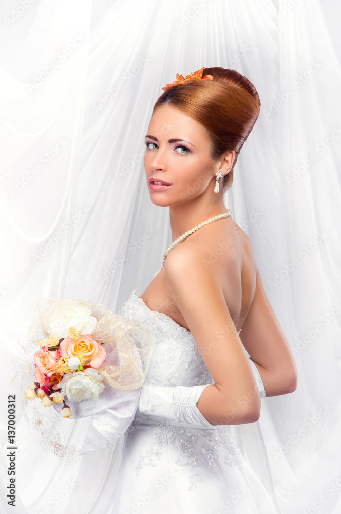 Young, beautiful and emotional bride with a beautiful flowers Young, beautiful and emotional bride with a beautiful flowers