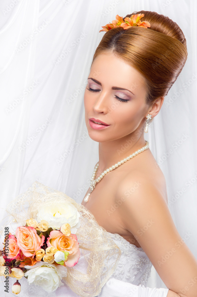 Young, beautiful and emotional bride with a beautiful flowers Young, beautiful and emotional bride with a beautiful flowers