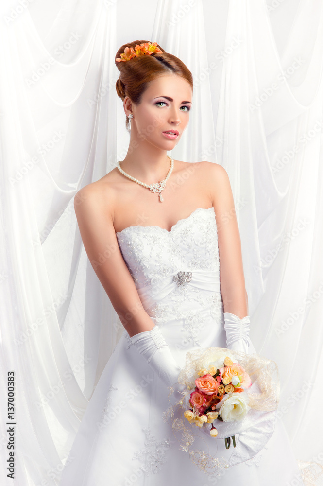 Young, beautiful and emotional bride with a beautiful flowers Young, beautiful and emotional bride with a beautiful flowers