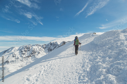 Traveling people moves hiking to mountains in winter