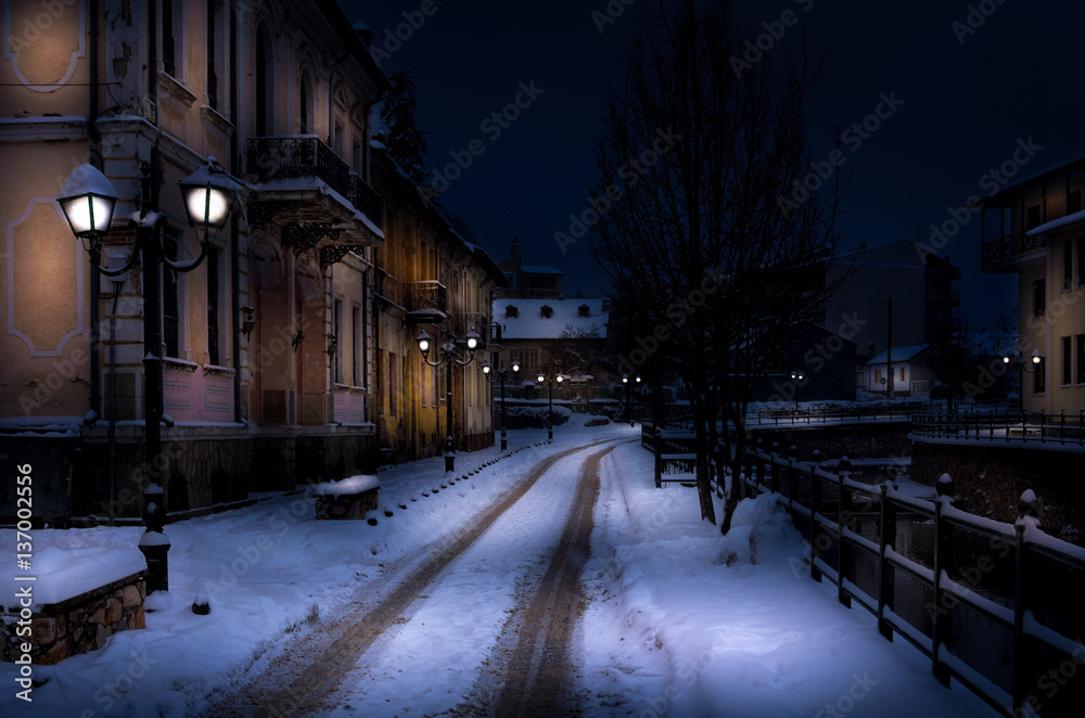 Winter night scene by the river of Florina, Greece, with snow