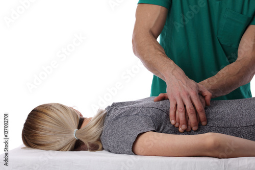 Chiropractic, osteopathy, dorsal manipulation. Therapist doing healing treatment on women's back . Alternative medicine, pain relief concept isolated on white. photo