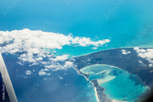 View from the plane to the city of Cancun, Mexico. Beautiful Ocean, the Caribbean Sea. View from above, top view