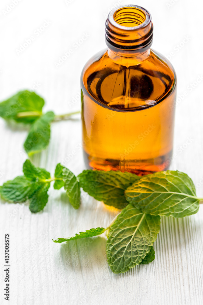 organic cosmetics with herbal extracts of mint on wooden background organic cosmetics with herbal extracts of mint on wooden background