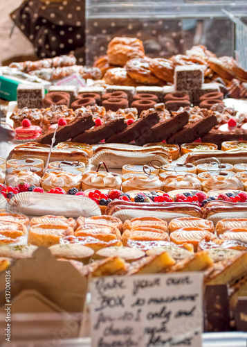Cakes and pastries at local gourmet market stall.