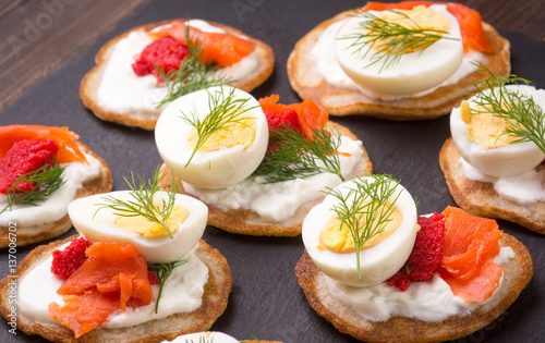 Russian buckwheat pancakes blini with cream and caviar