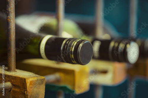 Bottles of wine in a wooden wine rack