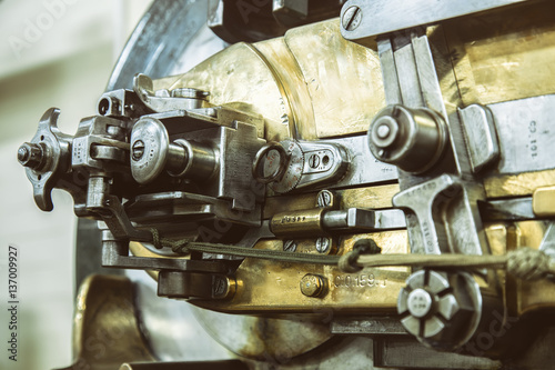 A piece of old brass and steel machinery