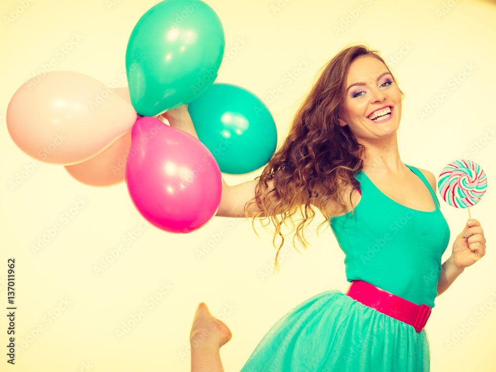 Woman with colorful balloons and lollipop Woman with colorful balloons and lollipop