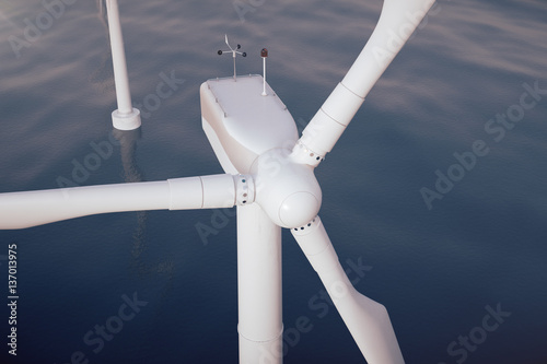Wind farm turbines caught in sunset sky. Beautiful contrast with the blue sea. ecological concept. 3d rendering