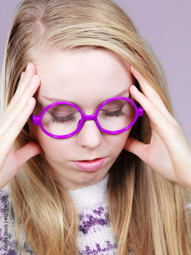 Nerdy woman in big holding head Nerdy woman in big holding head