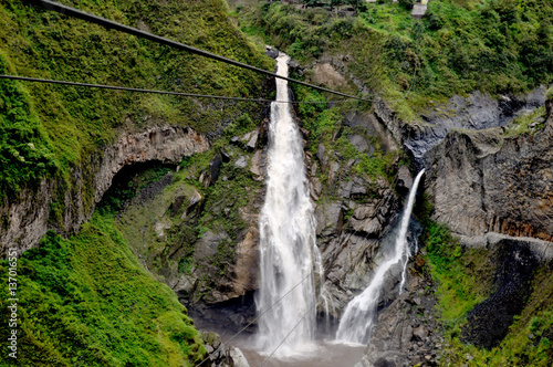zipline adventure against Manto de la Novia waterfall in Banos de Agua Santa, Tungurahua, Ecuador photo