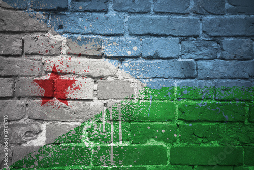 painted national flag of djibouti on a brick wall © luzitanija