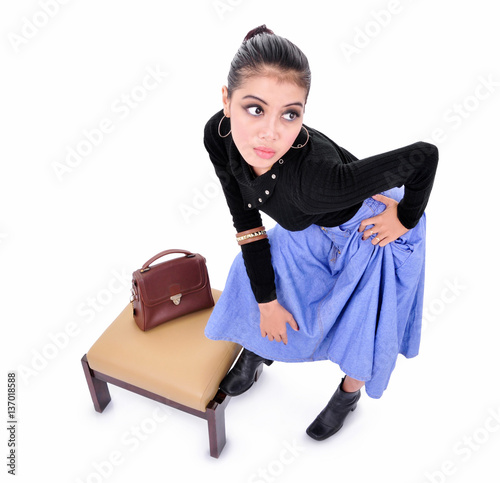 Beautiful young woman posing with bag, isolated on white background