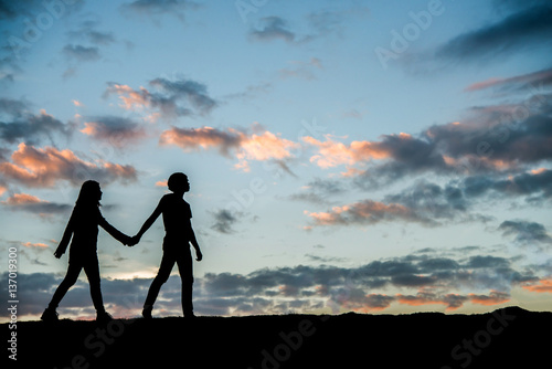 Happy young couple together against beautiful sunset. Freedom, 