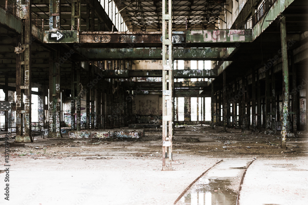 Filtered Abandoned vandalised factory ruin inside