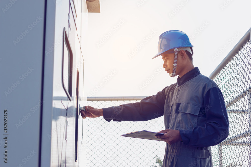 electrician working on checking status step up transformer high voltage on transformer yard at green energy solar power plant electrician working on checking status step up transformer high voltage on transformer yard at green energy solar power plant