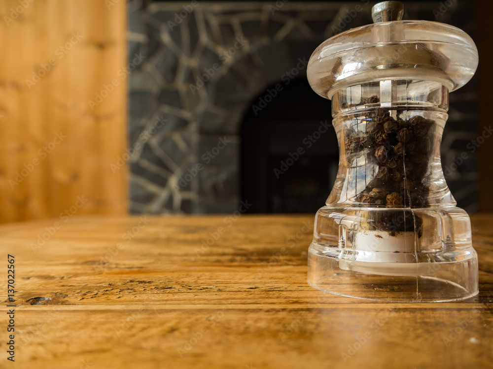 Pepper in glass on the wooden table