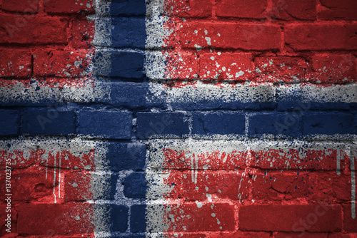 painted national flag of norway on a brick wall