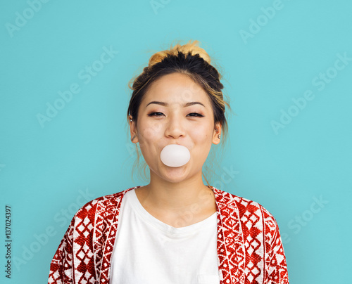 Young Girl Chewing Bubble Gum Concept photo