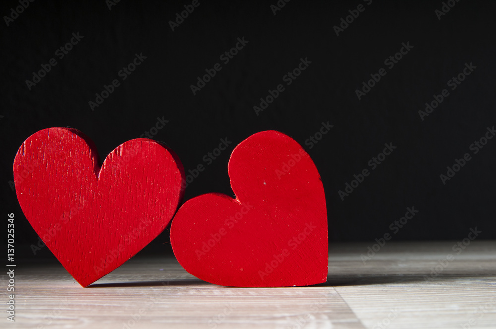 Fototapeta premium two hearts on dark wooden background