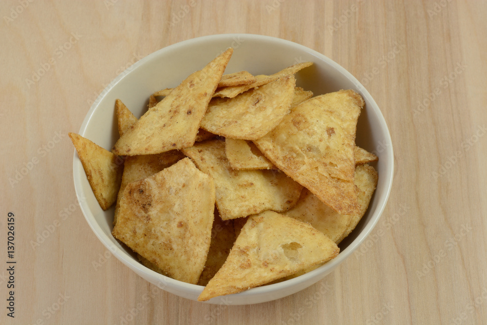 Pumpkin spice flavored crispbread snack in white bowl Pumpkin spice flavored crispbread snack in white bowl