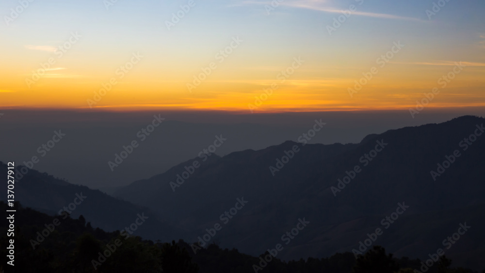 View of sunset with layer mountain.