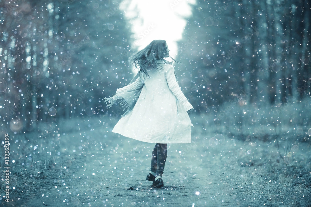young woman in a trench coat walks in autumn park young woman in a trench coat walks in autumn park