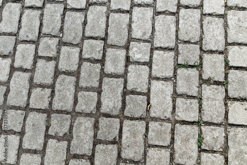 Abstract street background - gray paving slabs in the form of squares outdoors