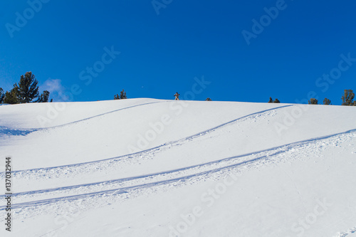 Snowboarder riding fresh snow.