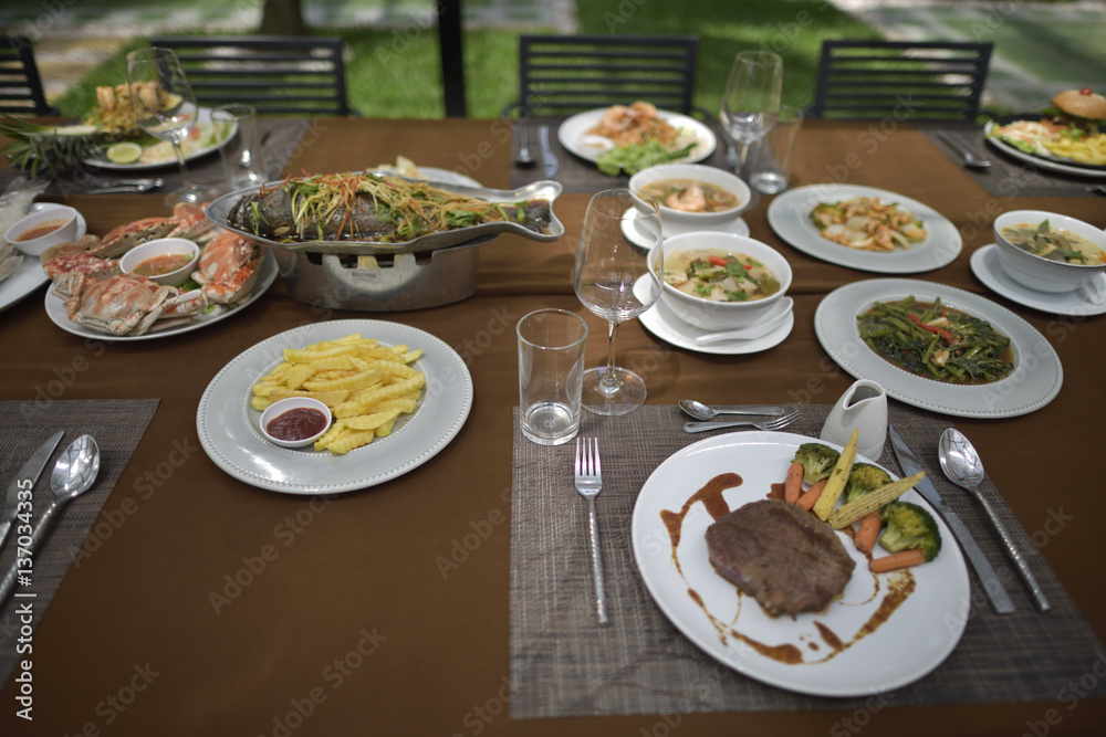 Delicious food set mixed full on the table in restaurant